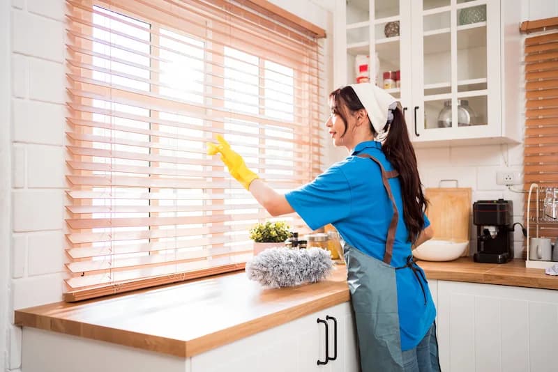 Professional cleaning team providing expert cleaning services in a bright, modern Kenosha home interior
